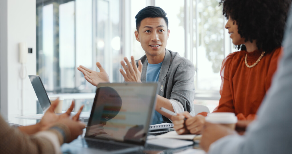 Meeting, Collaboration And Team Planning A Project Together In The Office Conference Room. Teamwork, Diversity And Business People In Discussion While Working On A B2b Corporate Strategy In Workplac